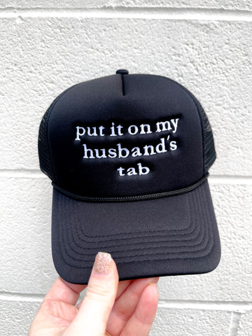 Black Put It On My Husbands Tab Trucker Hat