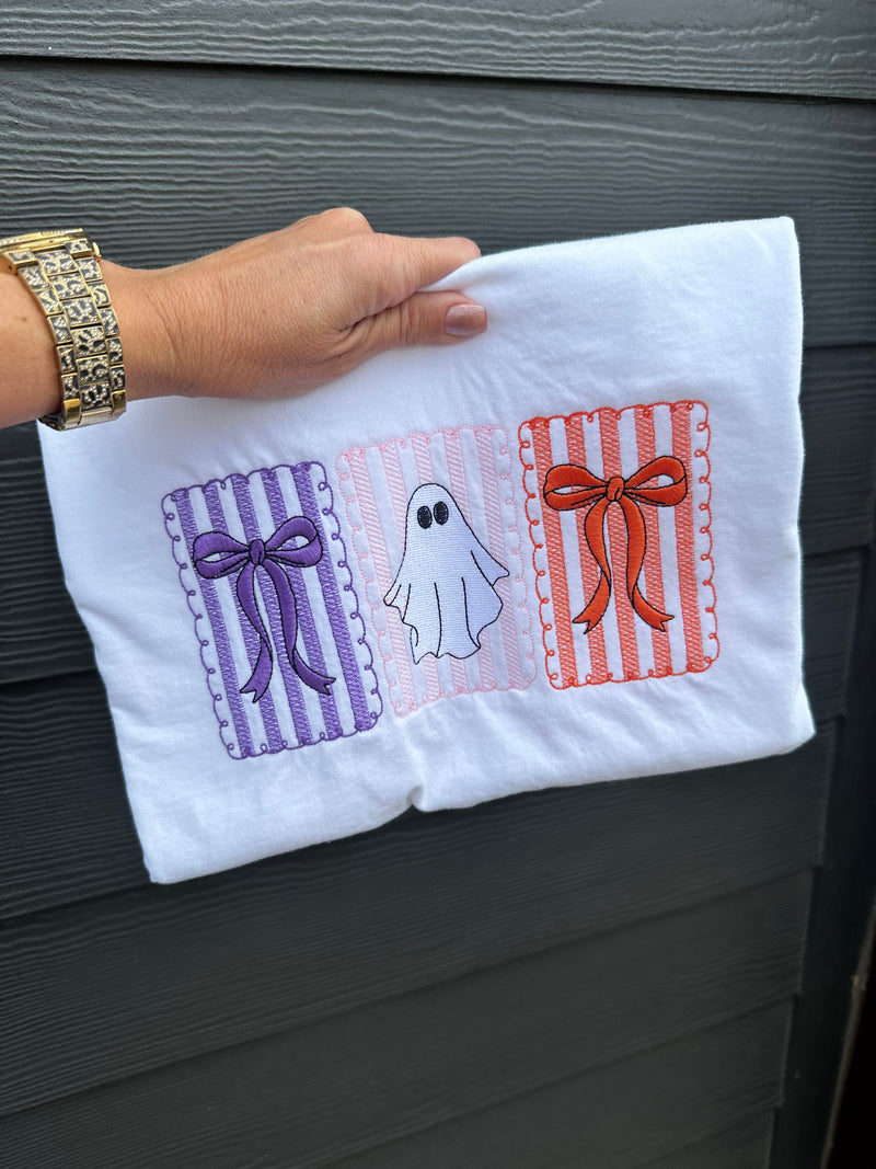 Close-up of embroidered ghost with coquette bow detail on Comfort Colors® shirt.